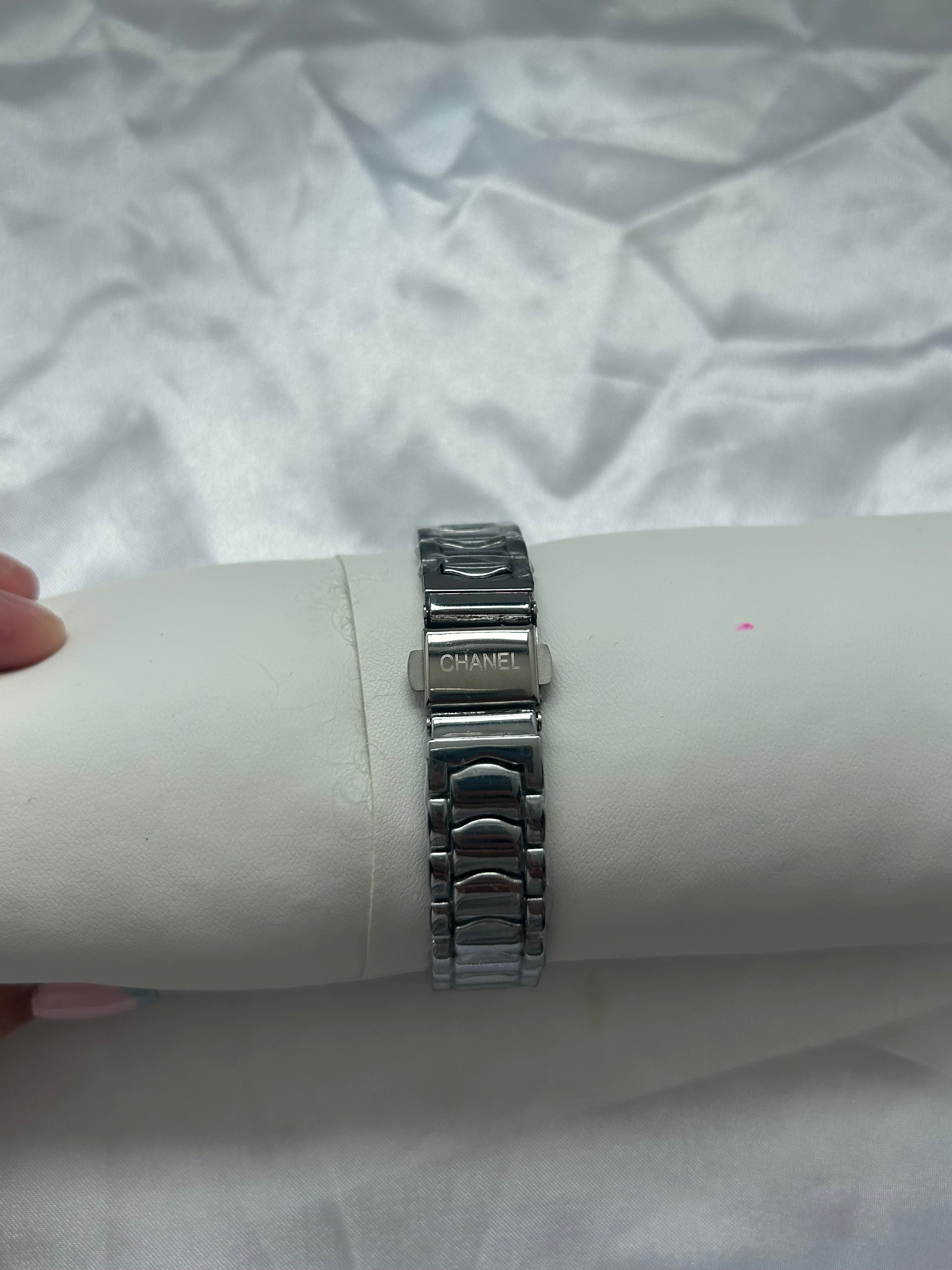 Silver CC white face watch